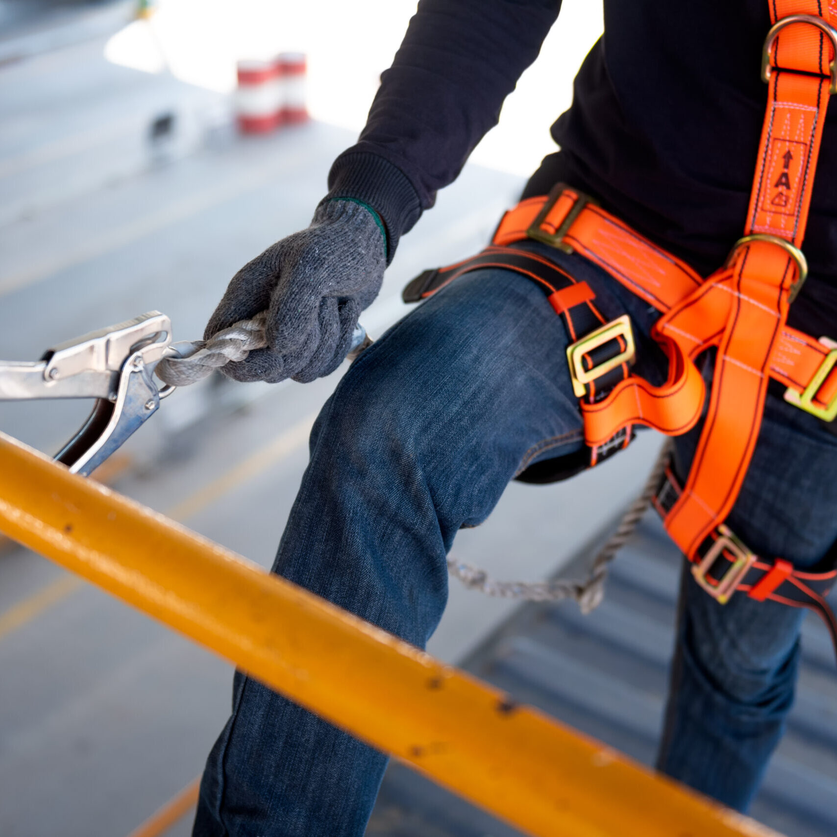 Electrical contractor using a safety harness