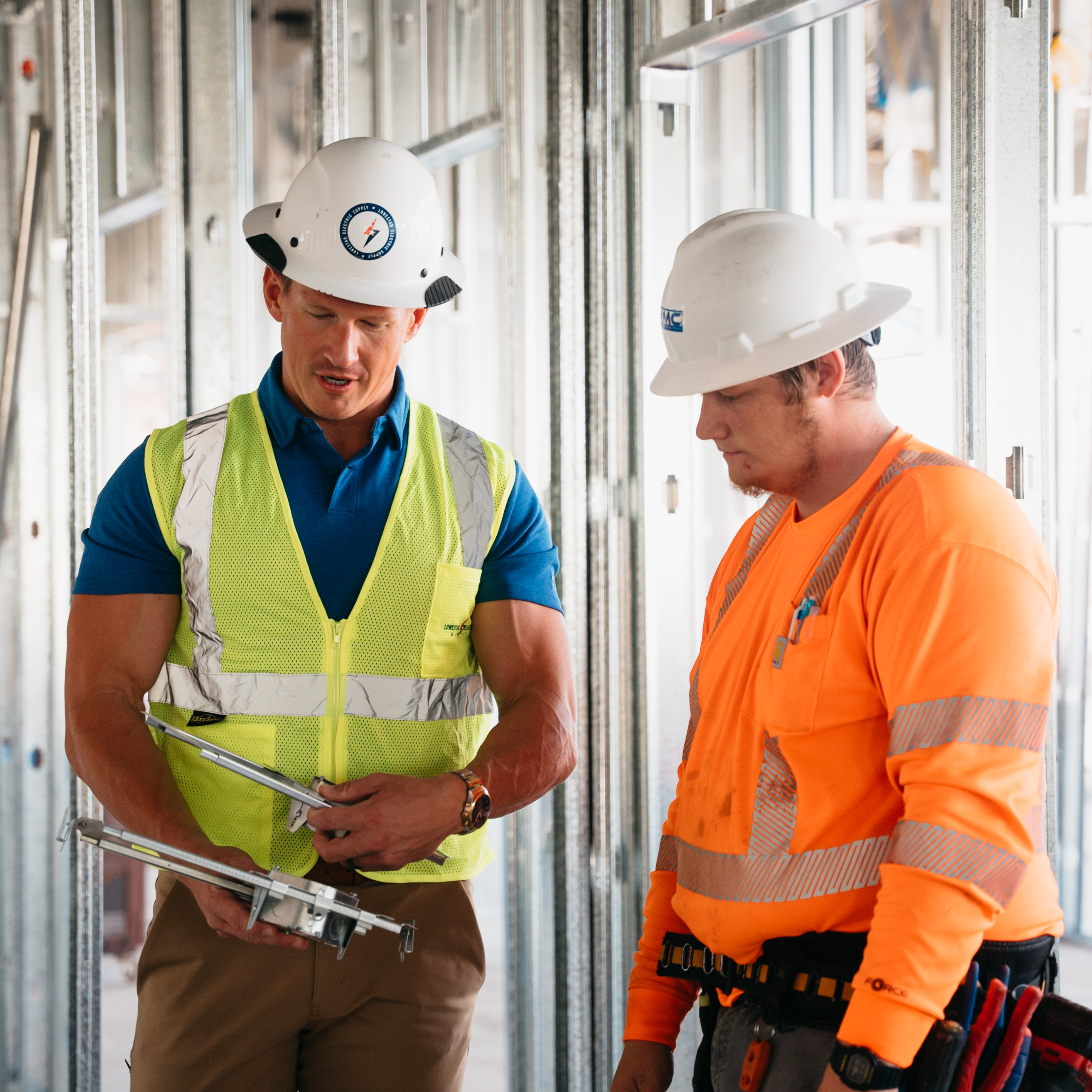 Electrical contractor using a safety harness